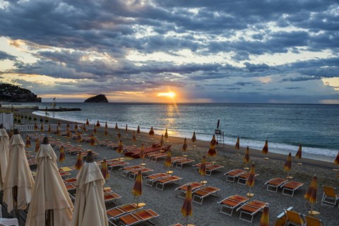 Empty beach and beach loungers, sunrise, Spotorno, Riviera di Ponente, Liguria, Italy, Europe