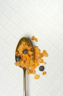 Cornflakes and blueberries in spoon, Breakfast