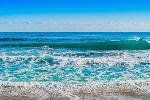 Vibrant ocean waves with rich blue tones and white surf, in South Korea