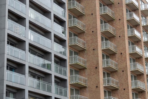 Multi-storey apartment building with glass balconies and brick exterior, Blankenberge, Flanders,