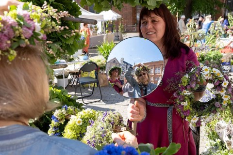Riga. Ligo festival. Binding of midsummer wreaths. Flower wreaths, stalls in the city square, Riga,