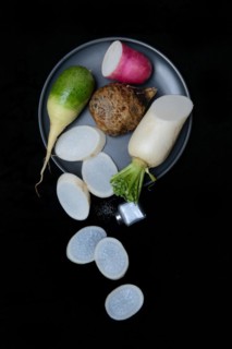 Various radishes on a plate, sliced, Raphanus