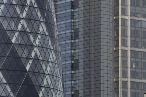 The Gherkin skyscraper building and nearby high rise office building, City of London, England,