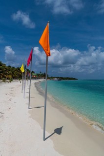 White sand beach with many flags, Bangaram island, Lakshadweep archipelago, Union territory of