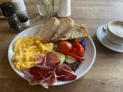 Food, breakfast, scrambled eggs, bread, South Tyrolean ham, tomatoes, cucumber, cappuccino, salt,