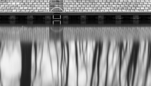 Long exposure, reflection of trees in the water of the Spree, Am Schleusenkanal, Berlin, Germany,