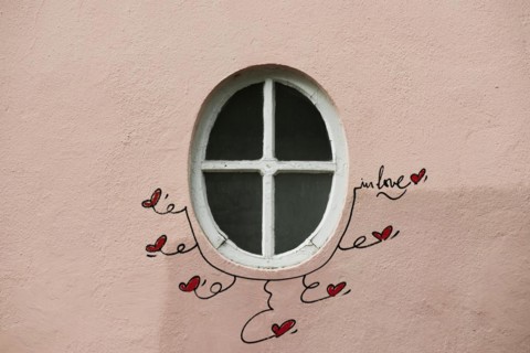 Street art, painted house wall with hearts and lettering on the theme of love, Montmartre, Paris,