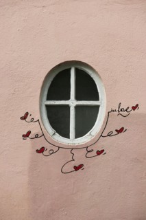 Street art, painted house wall with hearts and lettering on the theme of love, Montmartre, Paris,