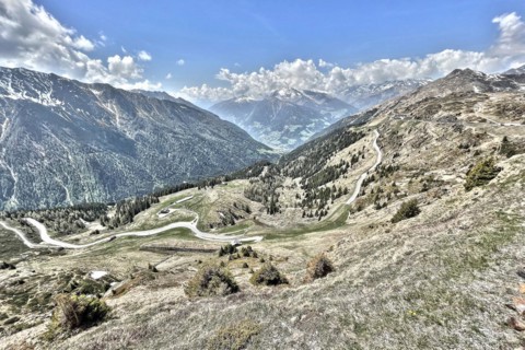 Photo with reduced dynamic saturation HDR of mountain pass alpine pass alpine mountain road alpine