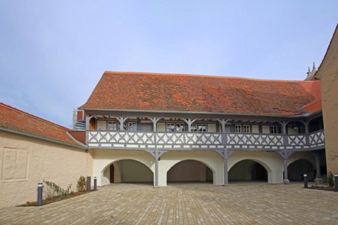 Hospital with arcade, historic half-timbered house, inner courtyard, Ochsenfurt, Lower Franconia,