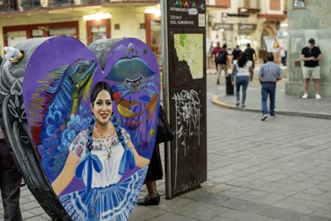 Oaxaca, Mexico, A container in the Zocalo for recycling bottles and cans, decorated and
