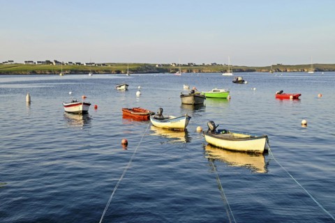 Boats on the blue waters of a bay, Ouessant Island, Finistere, Brittany, France, Europe