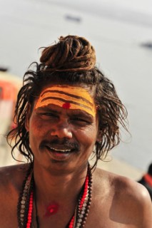 Close-up of a smiling sadhu with traditional painting in Varanasi, Varanasi, Uttar Pradesh, India,