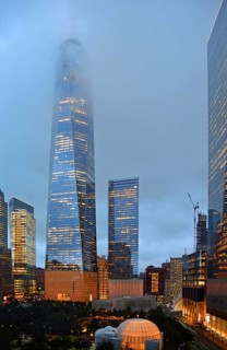 Skyscraper One World Trade Centre or Freedom Tower at the top shrouded in fog, at dusk, Ground