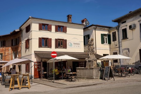 Canal ob Soci, picturesque town on the Soca, central square, Na Placu, restaurant and Neptune