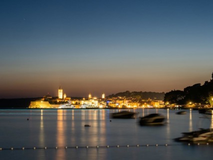 Night shot, illuminated church towers, old town centre of Rab, town of Rab, island of Rab, Kvarner