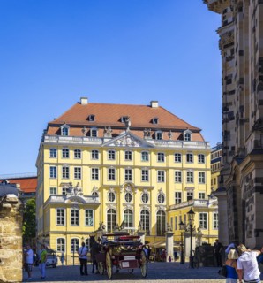 Tourist situation next to the Church of Our Lady in front of the rebuilt Coselpalais on the