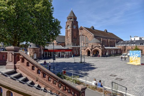 Historic Wilhelmine railway station, staircase, clock tower, reception building, neo-Romanesque and