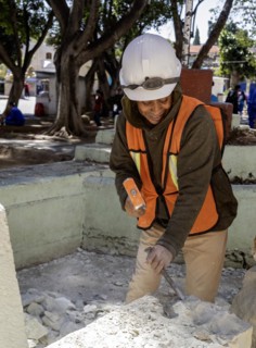 Oaxaca, Mexico, A worker chisels a block of stone to use in repairs on Guadalupe Church, Central