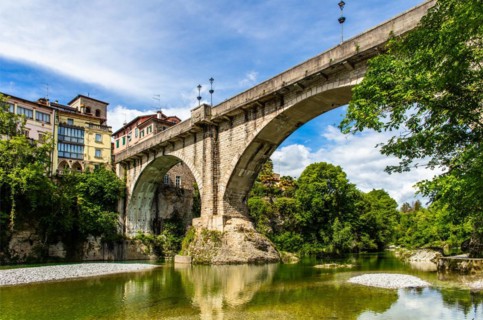 Ponte del Diavolo from the 15th century leads over the Natisone river into the historic centre,