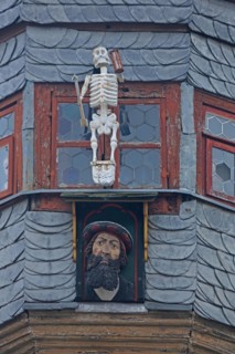 Lancet turret with skeleton and figure, head, window, detail, slate roof, slate slabs, slate