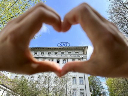 Hands Making a Heart Shape on SIG (Swiss Industrial Company) Industry Building in Neuhausen in