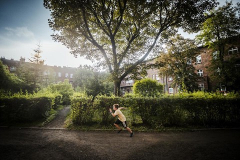 Nikiszowiec, Poland, 14 April 2020: A boy running through green courtyard in the mining district of