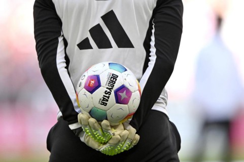 Goalkeeper coach Michael Rechner FC Bayern Munich FCB holds Adidas Derbystar match ball on his