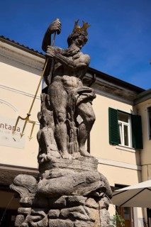 Neptune Fountain, the most important market fountain in Slovenia, in the village of Kanal ob Soci,