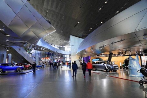 A car exhibition in a spacious hall with several visitors, BMW WELT, Munich, Germany, Europe