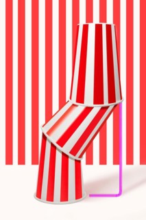 Three red striped drinking cups stacked inside each other with straw