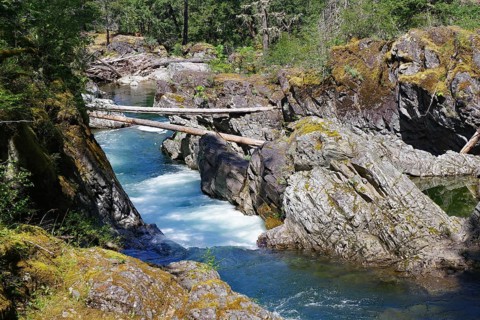 Crystal clear torrent between rocks, Pacific Rim National Park, Vancouver Island, British Columbia,