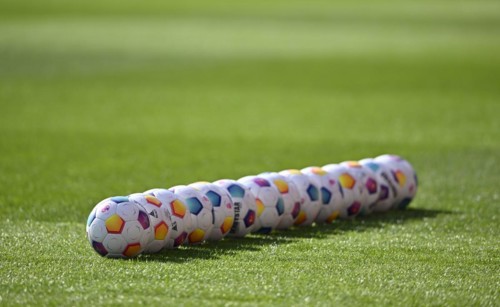 Adidas Derbystar match balls lie in a row on the pitch, Voith-Arena, Heidenheim,