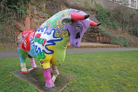 Colourful bull figure, sculpture, inscription, kitsch, rock staircase, bird staircase, Pirmasens,