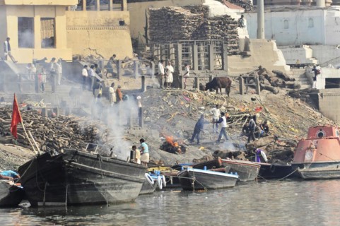 Close-up of the cremation rituals at the ghats of Varanasi with active bustle, Varanasi, Uttar