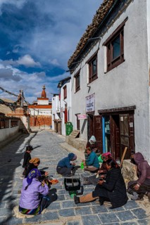 Local women practising traditional weaving in Lo-Manthang village, Kingdom of Mustang, Nepal, Asia