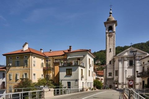 Canal ob Soci, picturesque village on the Soca river, trough gorge, in front the canal bridge over