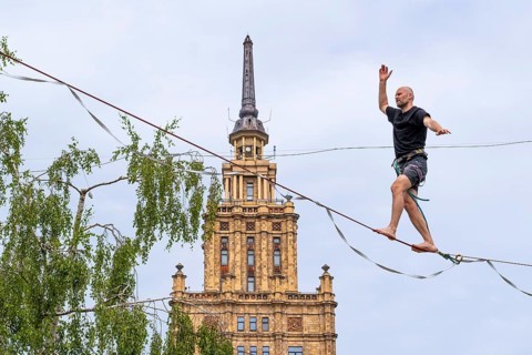 Riga. Alternative cultural centre near the Latvian Academy of Science. Tightrope walker on the