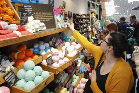 Customers in a LUSH cosmetics shop. The so-called Naked Shop offers 240 sustainable alternatives to