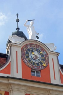 Pediment and clock with zodiac signs and Justitia with decorations on the baroque town hall, zodiac