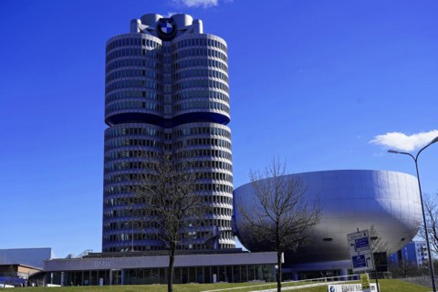 BMW Welt next to the cylindrical BMW Museum building on a sunny day, BMW WELT, Munich, Germany,
