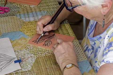 Oaxaca, Mexico, Susan Newell works on her image of tulips at an engraving workshop led by Alejandra