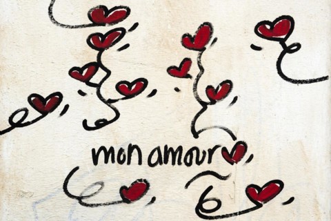 Street art, painted house wall with hearts and lettering on the theme of love, Montmartre, Paris,
