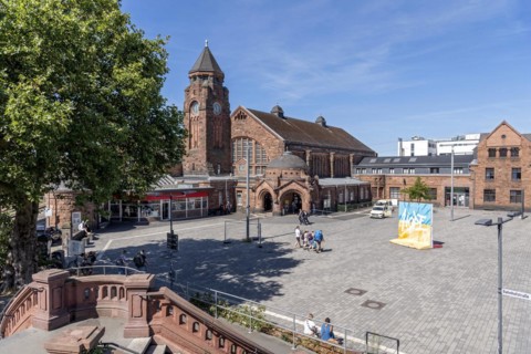 Historic Wilhelmine railway station, staircase, clock tower, reception building, neo-Romanesque and