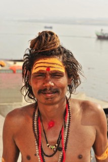 Portrait of a sadhu with face painting and religious symbols in Varanasi, Varanasi, Uttar Pradesh,