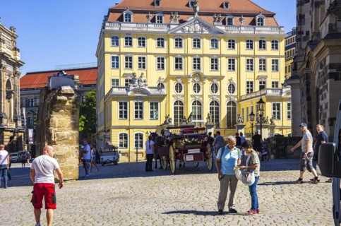 Tourist situation next to the Church of Our Lady in front of the rebuilt Coselpalais on the