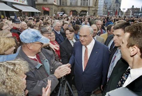 Chancellor Helmut Kohl greets CDU party supporters on the market square in Halle in front of his