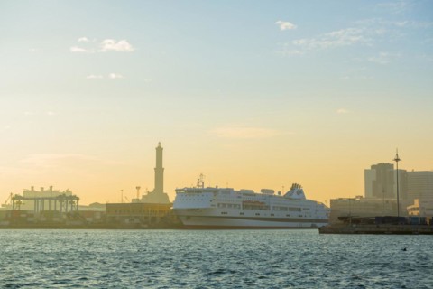 Port with Passenger Ship and Lighthouse in Sunset in Genoa, Italy, Europe