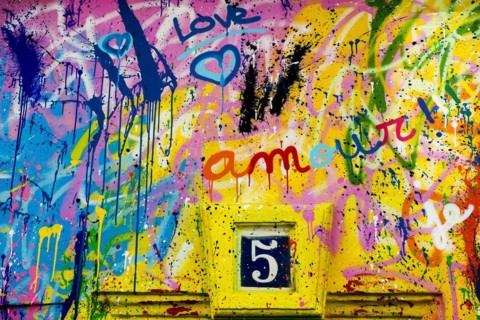 Street art, painted house wall with hearts and lettering on the theme of love, Montmartre, Paris,