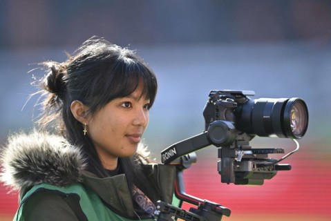 Stadium TV, camerawoman, Sony camera on Ronin rig, logo, Voith-Arena, Heidenheim,